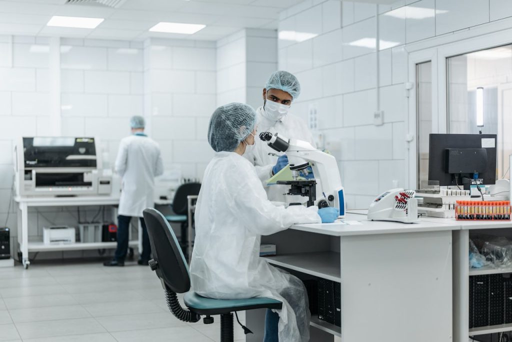medical-practitioners-inside-a-labaratory-8442096 Laboratory scientists conduct research using advanced microscopes in a well-equipped lab.